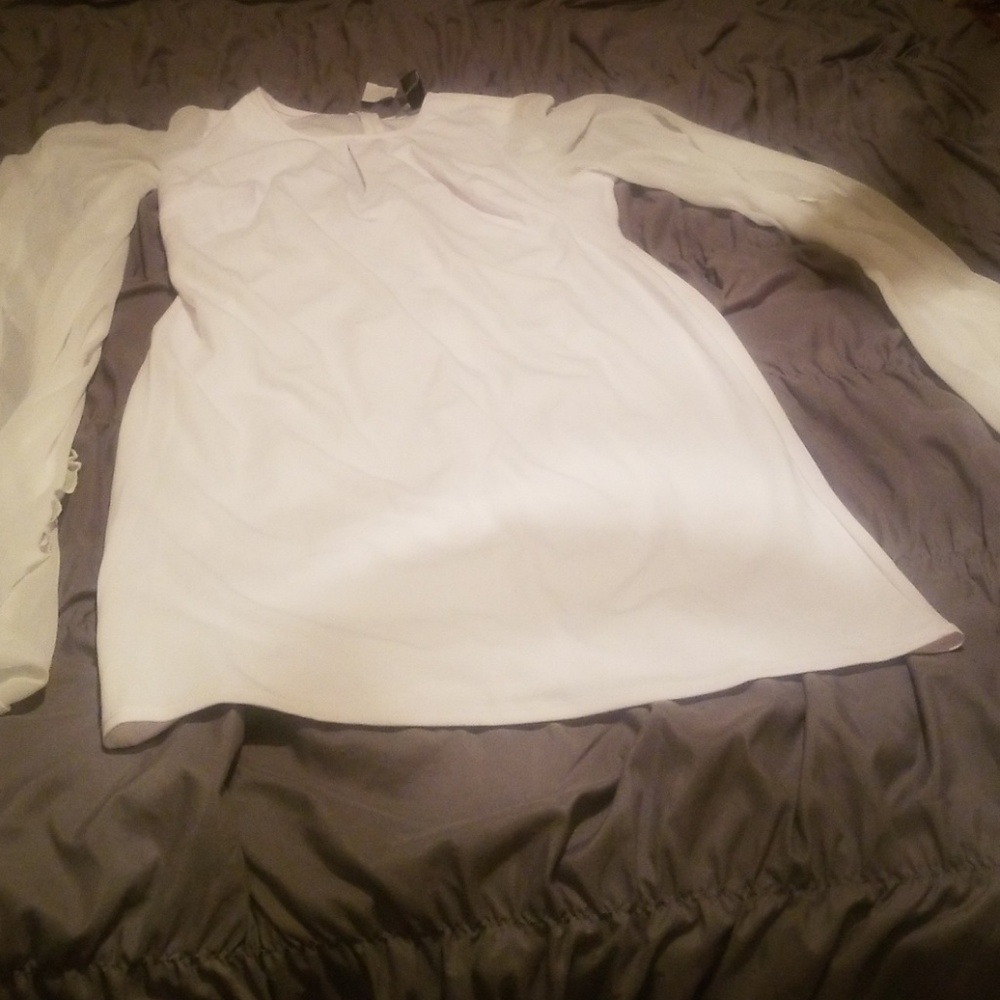 White dress with sheer sleeves.